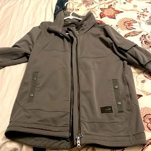 NICE Reebok Jacket with hidden hood.